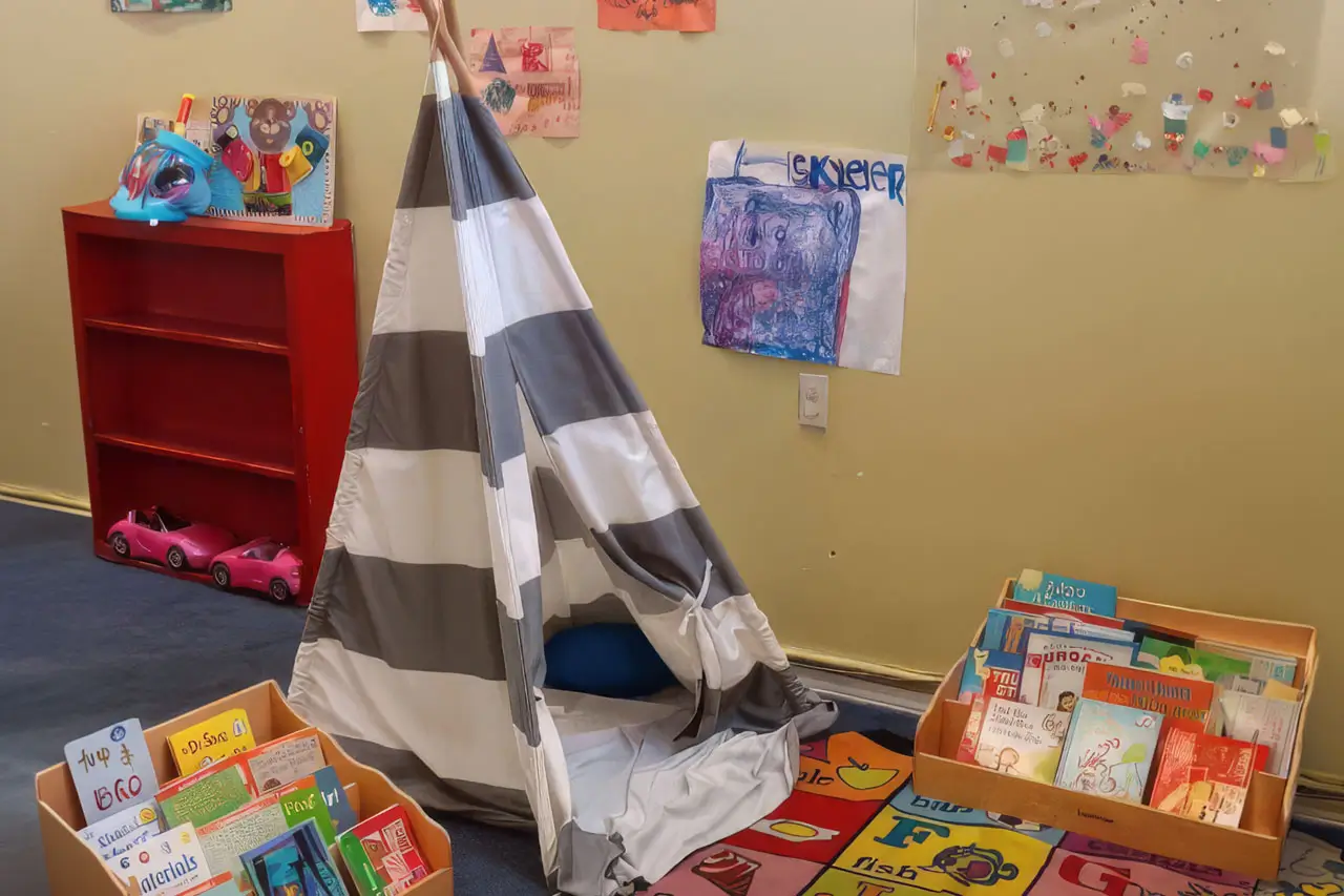 A colorful play area featuring a teepee and a bookshelf filled with children's books.